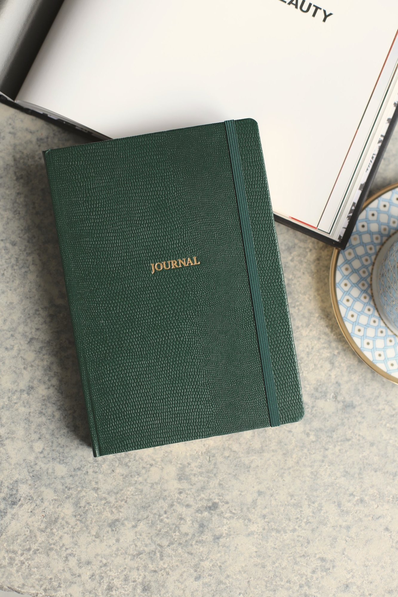 A hardcover notebook with Task Cards and a Weekly Planner